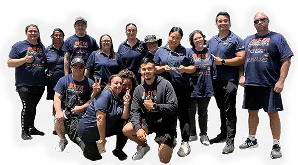 A group photo of the META team members smiling and posing together.