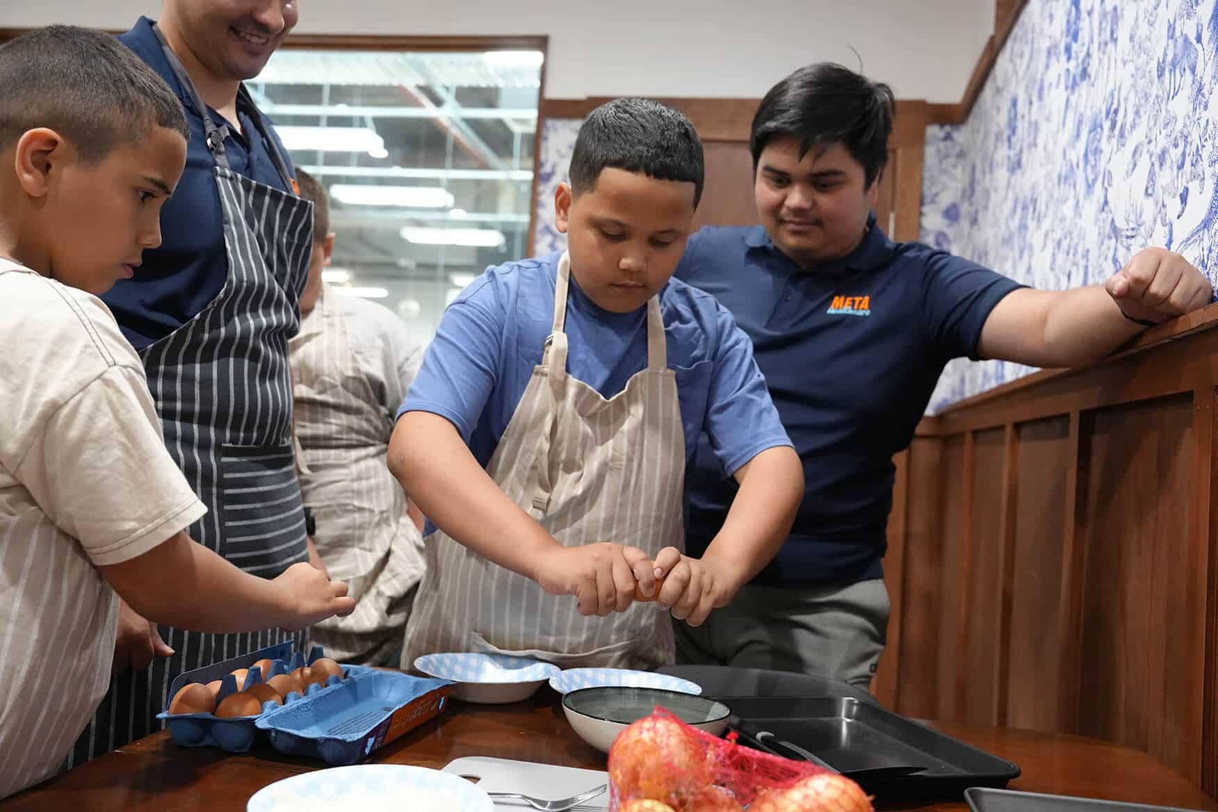 Children enjoying a cooking activity during a social session