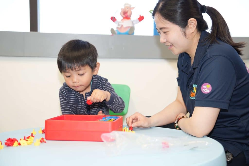 Child participating in a play-based therapy session with a Meta Healthcare therapist